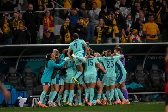 The Matildas celebrate their fourth goal against Canada.