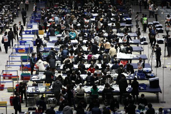 Officials in Seoul count votes cast in Parliamentary election amid the coronavirus outbreak.
