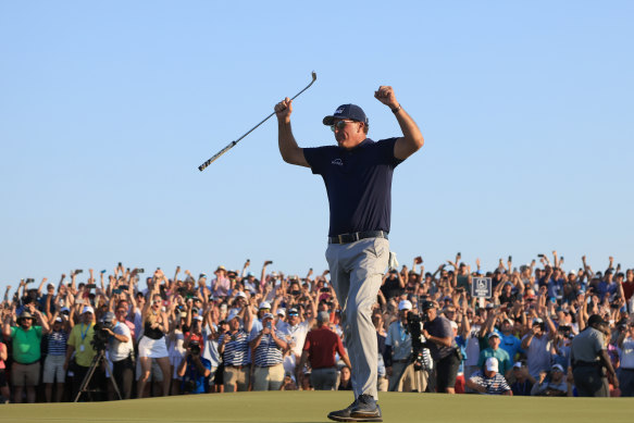 Phil Mickelson celebrates his record-breaking PGA Championship victory.