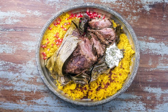 Slow-cooked Omani lamb shuwa, studded with pomegranate seeds.