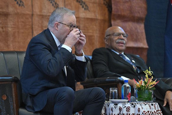 Prime Minister Anthony Albanese drinks kava with his Fijian counterpart, Sitiveni Rabuka, at a welcome ceremony in Suva.