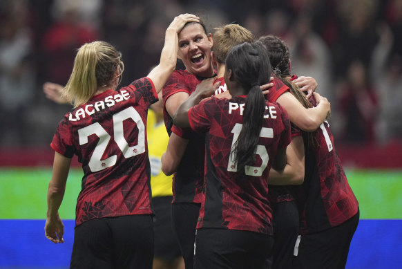 Canada celebrate after scoring first against Australia.