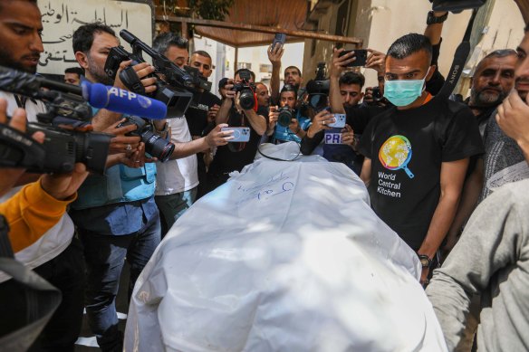 Medics prepare the bodies of World Central Kitchen workers for their return to their home countries.