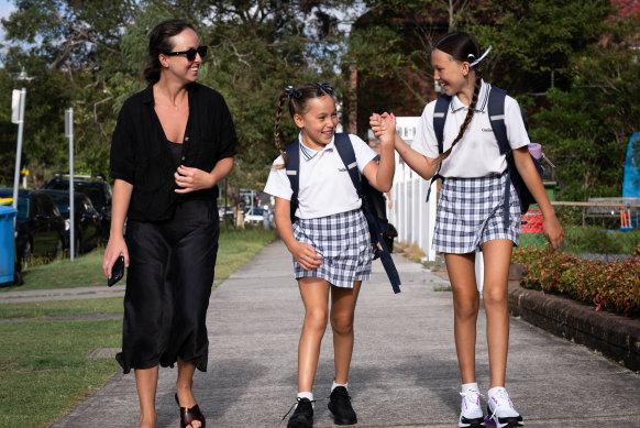 Bernardo Mason walks with her daughters Pearl, 8, and Ivory, 10, to Galilee Catholic Primary School in Bondi Beach.