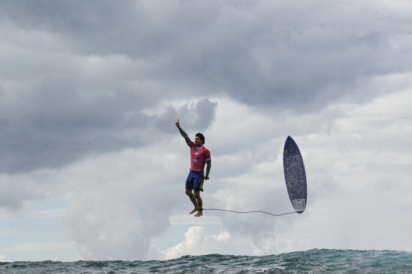 Brazil’s Gabriel Medina reacts after riding a large wave in the men’s surfing heats at the 2024 Olympic Games.