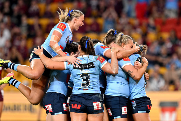 The Sky Blues celebrate after Emma Tonegato scores first.