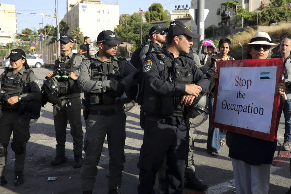 Israeli police stand guard at a demonstration in support of Palestinians in Sheikh Jarrah of East Jerusalem, where dozens of families face imminent forcible eviction from their homes by Israeli settlers.