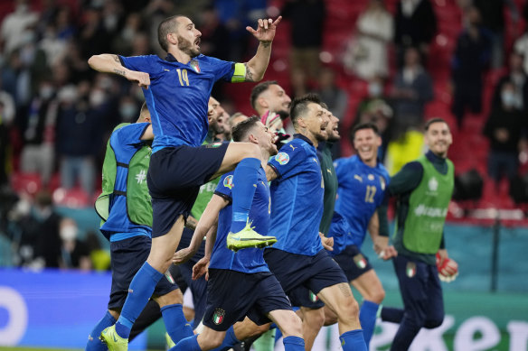 The Italians celebrate advancing to the quarter-finals.