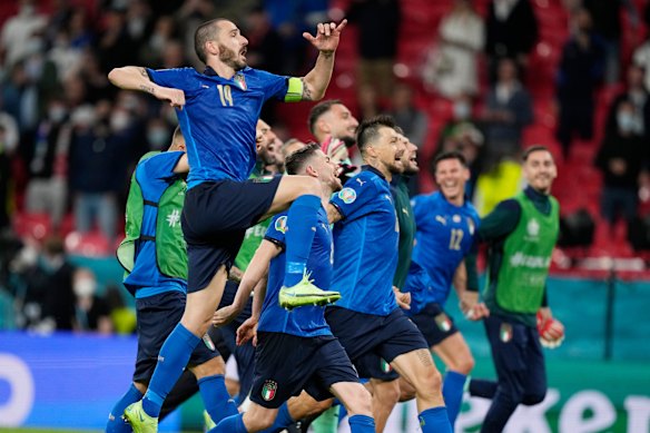 The Italians celebrate advancing to the quarter-finals.