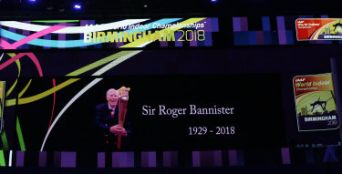 A video screen shows a tribute to Roger Bannister at the World Athletics Indoor Championships in Birmingham.