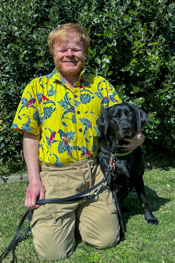 Phillip Chalker with his previous seeing eye dog Sally, a Labrador.