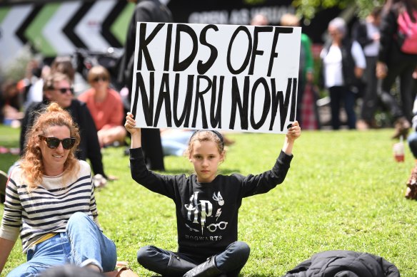 Scarlett Wright with her mother Elizabeth Hindmarsh during a rally at the steps of the State Library in Melbourne, on Saturday.