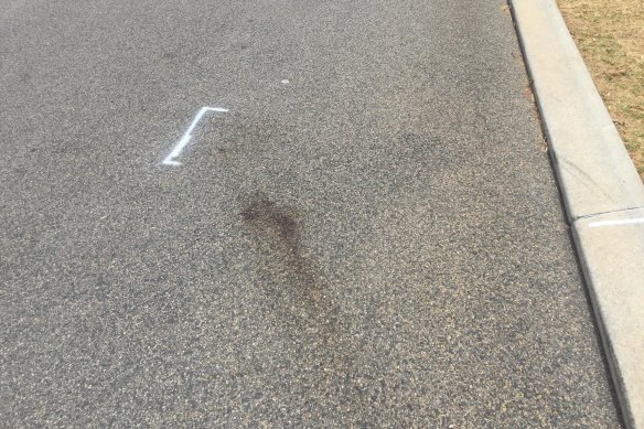 Blood stains mark the road, where the pedestrian was hit by the car. 