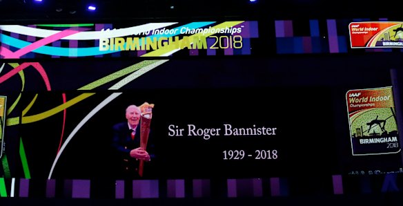 A video screen shows a tribute to Roger Bannister at the World Athletics Indoor Championships in Birmingham.