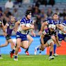 Matt Burton makes a break against Melbourne.