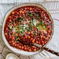 Serve puttanesca chickpeas over pasta to stretch this dish further.