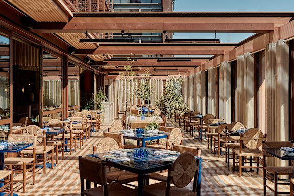 Linen drapes and greenery add to the southern European feel.