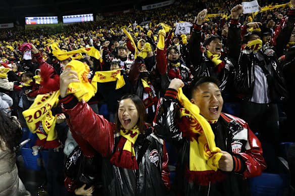 Twins fans cheer during the Korean Series Game Five between LG Twins and KT Wiz at Jamsil Stadium.