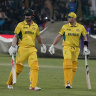 Australia’s Steve Smith, right, and Travis Head walk off the field after rain stops the play.