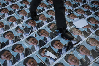 During the 2019 protests, photocopies of a picture of pro-Beijing lawmaker Junius Ho lined footpaths leading to a Hong Kong subway station, forcing commuters to tread on his face.