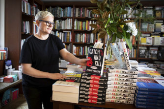Anna Low, the owner, stacks the shelves at Potts Point Bookshop.