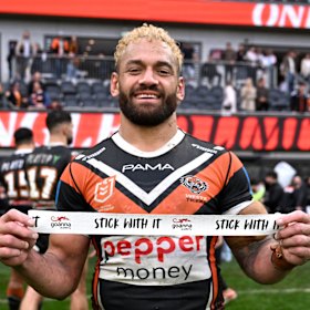 Apisai Koroisau and the Tigers try to make amends by showing the “stick with it” tape after their clash with the Bulldogs.