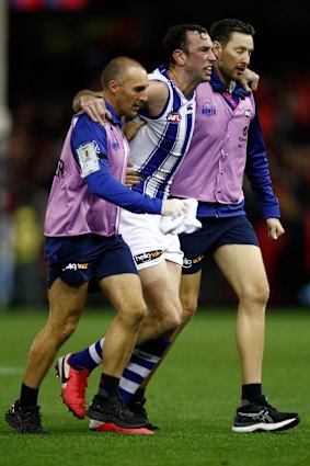 Todd Goldstein is helped by trainers but later returned to the field.