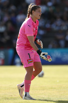 Teagan Micah removes a can that was thrown onto the pitch in City’s second clash against Victory.