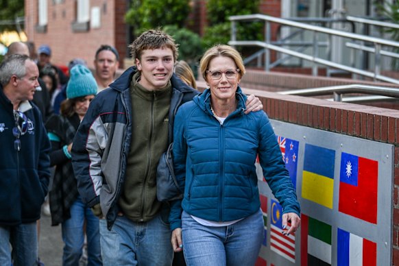 Zoe Daniel and her son, Arkie, head to the polling booth on May 3.