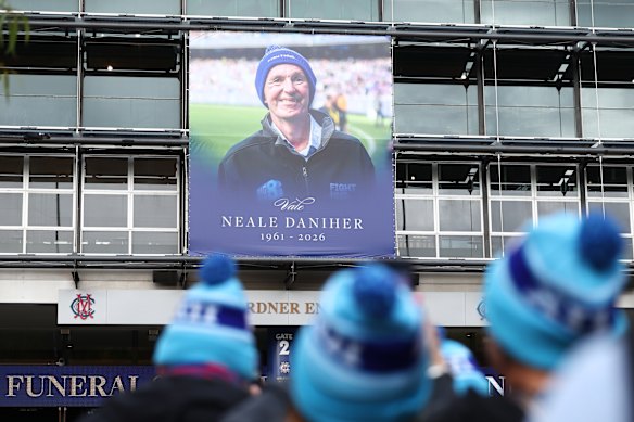 The distinctive FightMND blue beanies were omnipresent at Neale Daniher’s state funeral.