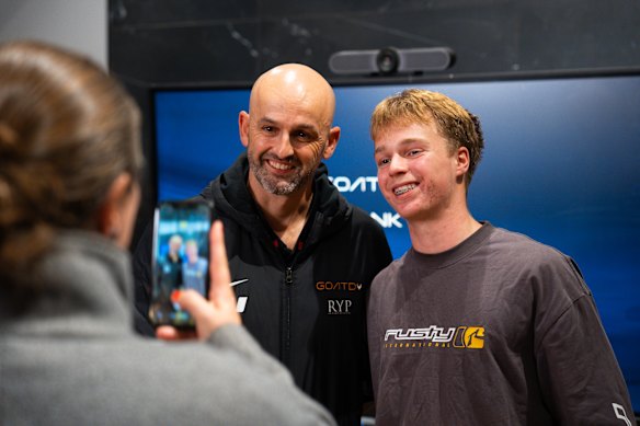 Nathan Lyon with a young cricket fan in Orange. 