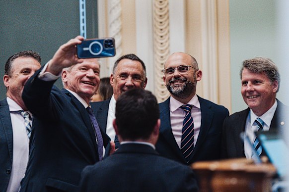 Treasurer David Janetzki (second from right) smiles for a selfie with fellow LNP politicians after delivering his first Queensland budget.