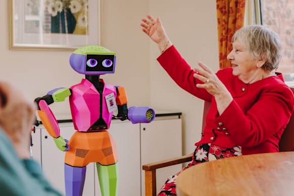 Andromeda’s Abi with residents in a Mecwacare facility.