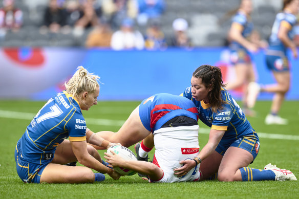 Laishon Albert-Jones is tipped on her head during the Knights clash with the Eels on Sunday.