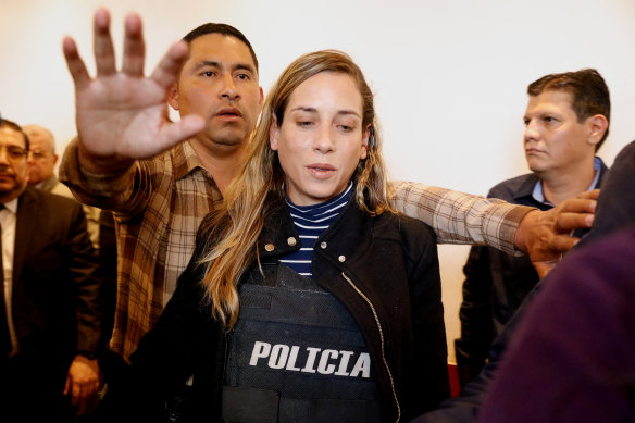 Andrea Gonzalez attends a press conference on behalf of the campaign while wearing a bulletproof vest, in Quito, Ecuador, on Thursday.