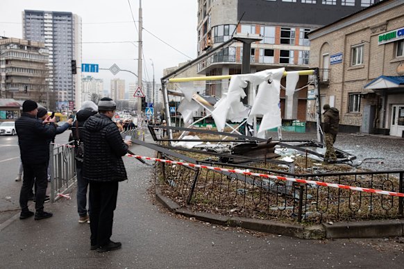 Kyiv residents inspect the consequences of shelling.