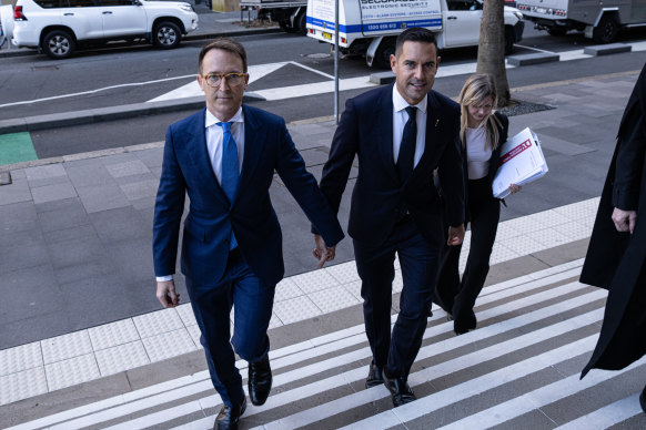 Sydney MP Alex Greenwich (right) and his husband Victor Hoeld outside the Federal Court in Sydney on Friday.