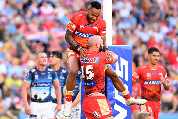 The Dolphins celebrate a Mark Nicholls try against the Titans.