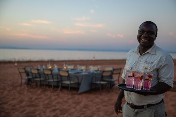A luxury lakefront dining experience at Bumi Hills Safari Lodge.
