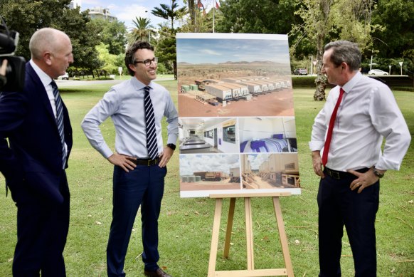 Emergency Service Minister Stephen Dawson, Rio Tinto iron ore chief executive Simon Trott and WA Premier Mark McGowan stand around images of the 40-person donga camp being gifted to the WA government.