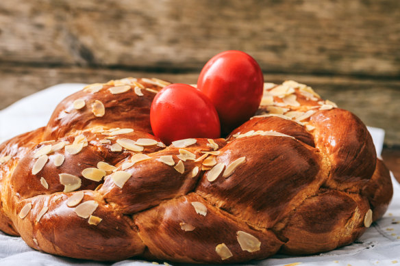 Easter traditional sweet bread, tsoureki, and red dyed eggs.