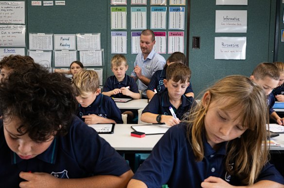 Sam Higgins, a teacher at The Entrance Public School, with a year 4 class.