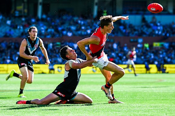 Max Kondogiannis is tackled by Zak Butters during the Dons’ heavy loss to Port.