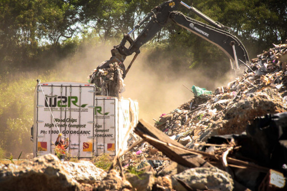 Out of sight: Raw interstate waste is reloaded on to local trucks at Willawong - a recycling facility about 16km south of the Brisbane CBD. They will take it straight to landfill.