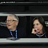 Bill Gates and Paula Hurd watch on Rod Laver Arena during the men’s doubles final.