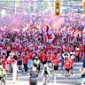 Members of the Voyageurs, Canada’s national team supporters, march toward Toronto Stadium.