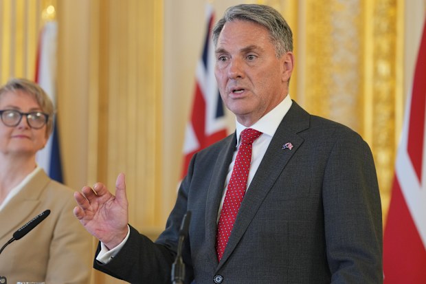 Richard Marles speaks as Britain's Foreign Secretary Yvette Cooper listens on during AUKMIN press conference