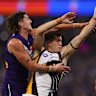 Luke Jackson of the Dockers and Lloyd Meek of the Hawks contest the ruck d