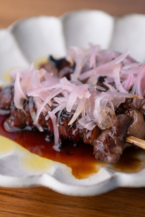 Teriyaki-glazed wagyu rump cap  skewers topped with pickled shallots.