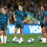 Mary Fowler (right) prepares to partner with Caitlin Foord (centre) in attack during the warm-up before the Matildas’ opening match against Ireland.